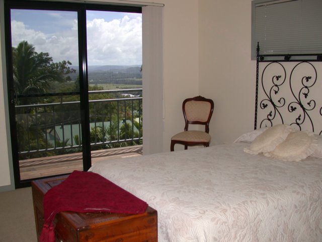16 - Master Bedroom going out onto the deck with the view